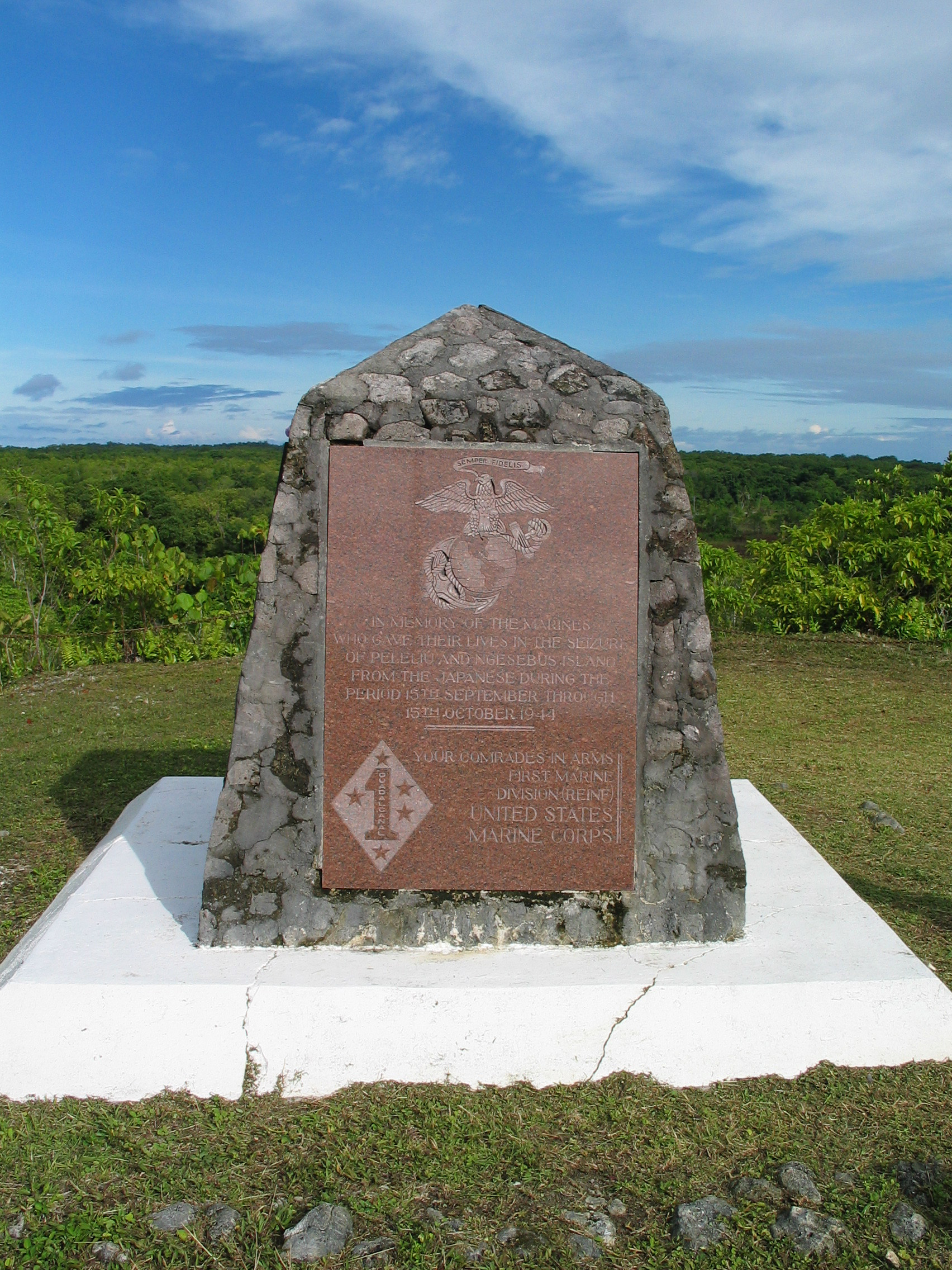stone monument with plaque on hilltop